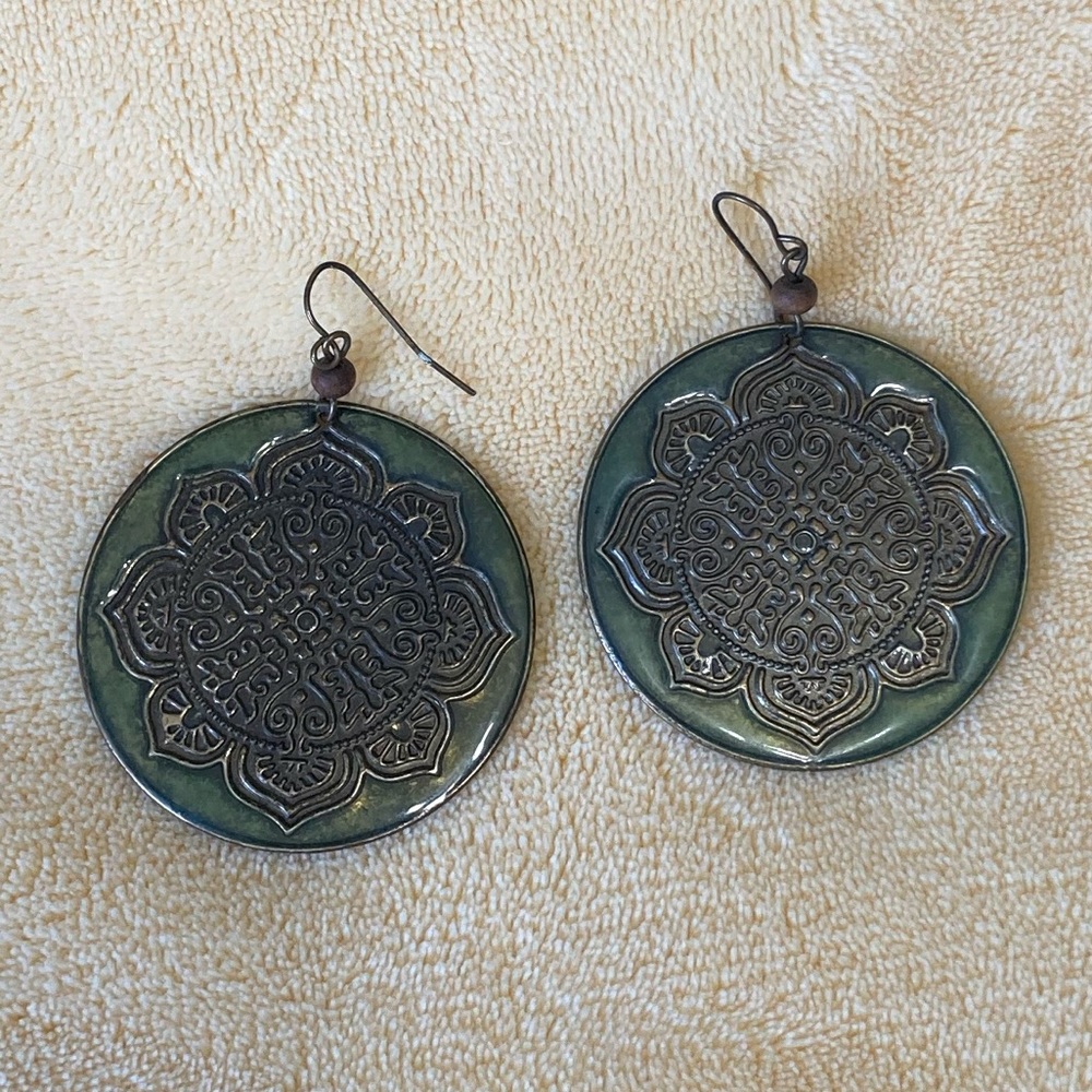 Large embossed disk dangle earrings
